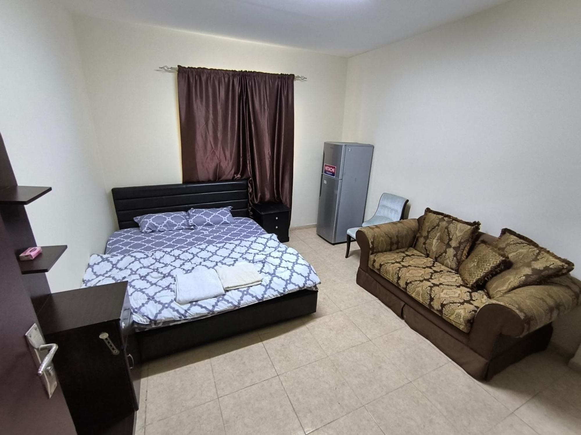Opposite Mega Mall In Telephone Shops Roundabout Flat No 203 * Sharjah
